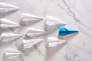 Business leadership ,financial concept. Blue paper plane leadership